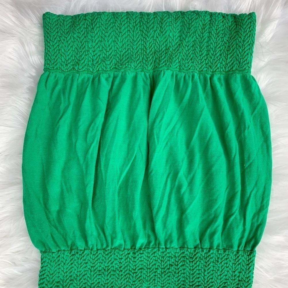 Green tube top with elastic waistline and top. Beautiful color!!  One size.